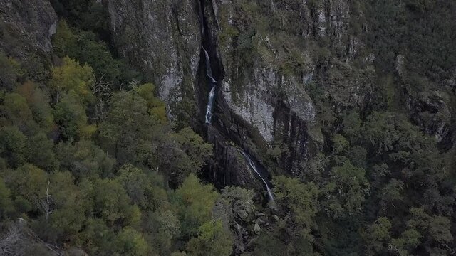 A beautiful aerial view of the Cascata de Pitoes das Junias, Portugal on a gloomy day in 4K