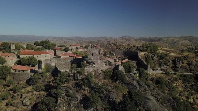 A high angle view of the Castle of Sortelha, Portugal and the other buildings on a gloomy day in 4K