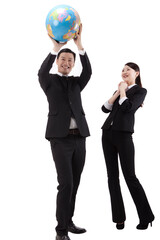 Business people holding a globe