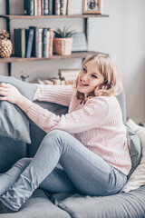 Happy redhair woman with amazing smile laughing in her room. Indoor portrait of emotional woman in the loft fun in morning.