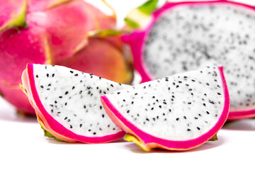 Fresh whole and sliced dragonfruit isolated on white background