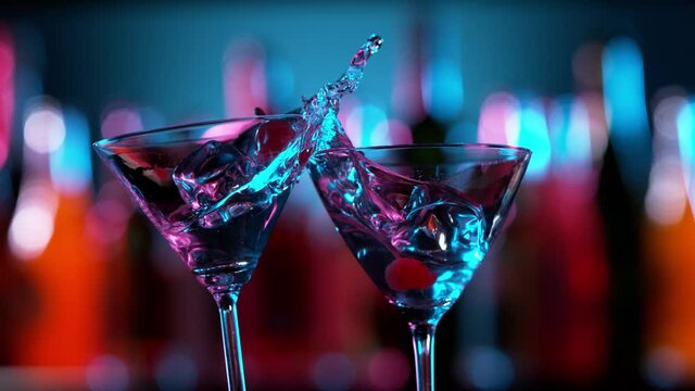 Super slow motion of having a toast with two martini glasses. Filmed on high speed cinema camera, 1000 fps.