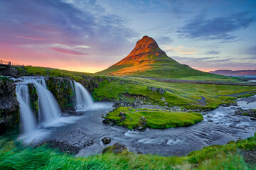 Awesome evening with Kirkjufell volcano the coast of Snaefellsnes peninsula. Dramatic and...