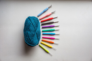 Flat lay of knitting string and hooks