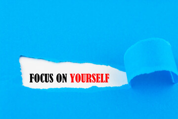 FOCUS ON YOURSELF message written under torn paper.