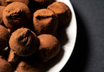Chocolate truffles on a stone plate