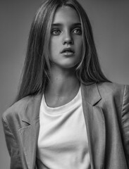 A beautiful young girl with blonde hair poses as a fashion model in different images and styles. Added noises and no sharp focus for the author's artistic design.