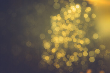 Gold bokeh blur defocus in black backgeound