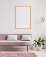 Poster mockup with vertical frames on empty white wall in living room interior with pink velvet sofa.
