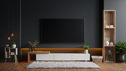 Mockup a TV wall mounted in a dark room with a black wall.