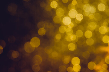 Abstract decorat  bokeh holiday christmas glowing lights on black
