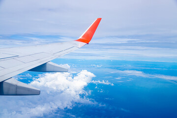 Airplane wing On the blue sky