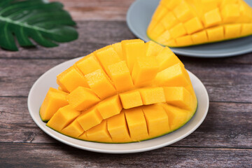 mango slice isolated on wooden background Clipping Path