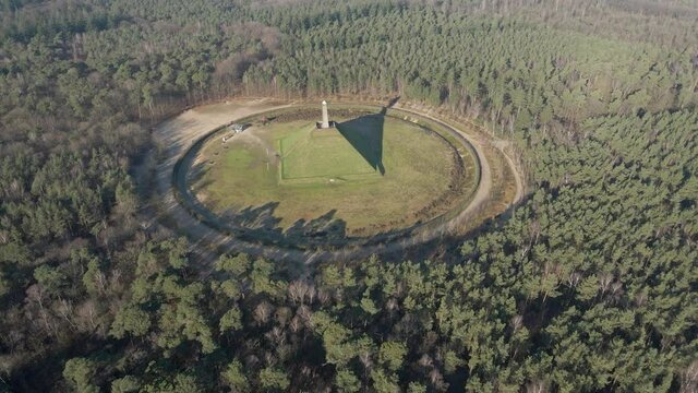 Wide Aerial of Austerlitz Pyramid surrounded by a beautiful forest. The Piramide van Austerlitz is a monument in the Netherlands, built in 1804 as a tribute to Napoleon Bonaparte.