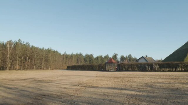 Panning past Austerlitz Pyramid - wide. The Piramide van Austerlitz is a monument in the Netherlands, built in 1804 as a tribute to Napoleon Bonaparte.