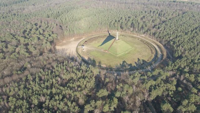 Wide aerial of Austerlitz Pyramid surrounded by forest. The Piramide van Austerlitz is a monument in the Netherlands, built in 1804 as a tribute to Napoleon Bonaparte.