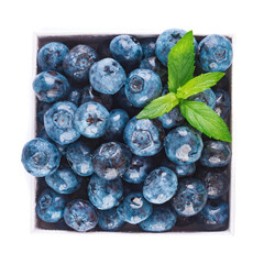 Fresh blueberries and leaves, berry frame isolated on white background, top view