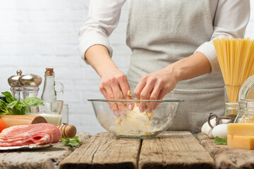The chef prepares making baking dough, italian pasta or focache or bread.