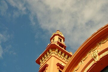Historic theatre in Bari, Italy, highlighted against blue sky