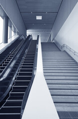 Interior view of escalator and stairway in modern architecture