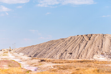 People gathering salt of pink salty Siwash Lake, colored by microalgae, famous for antioxidant...