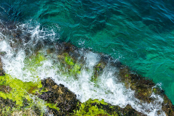 rock in the sea, blue waves, rocks, foam, raging sea, spray, top view down