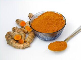 Turmeric powder with root on white background