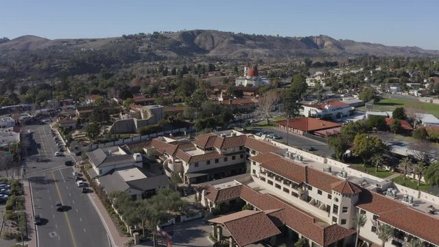 Daytime aerial view of the Spanish Colonial era mission and surrounding city of downtown San Juan Capistrano, California, USA. 