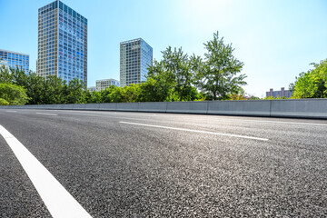 Asphalt road and modern city commercial buildings in Beijing,China.