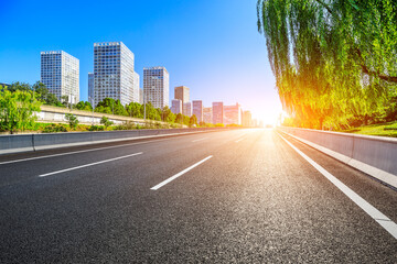 Asphalt road and modern city commercial buildings in Beijing,China.