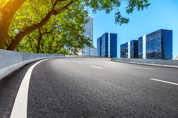 Asphalt road and modern city commercial buildings in Beijing,China.