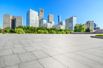 Empty square floor and modern city commercial buildings in Beijing,China.