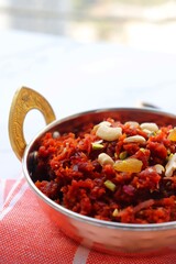  Gajar Halwa. Indian carrot pudding. It's a sweet dessert made from carrots, sugar, and cream. Garnished with cashew, almond, Raisin, and pistachio.