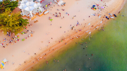 Obraz na płótnie Canvas Aerial view of Sunset in Phu Quoc beach with nice view. Tourists, sunbeds and umbrellas on beautiful day in Sanato beach, Phu Quoc island, Vietnam