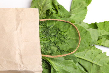a bundle of fresh spinach on white background