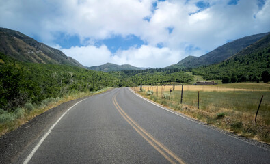 Cloudy sky with the road on a warm summer day in the Uinta National Forest in Utah