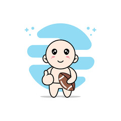 Cute baby character holding a rugby ball.