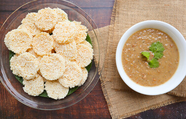 Crispy rice cracker served with minced pork, shrimp and peanut dipping sauce - Thai appetizer...