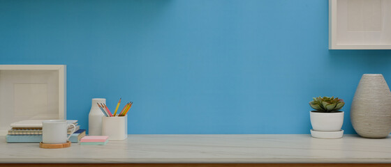 Workspace with stationery, decorations and copy space in home office room © bongkarn