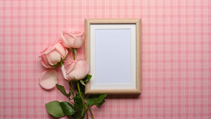 Mock up frame on pink Scott table decorated with pink flower
