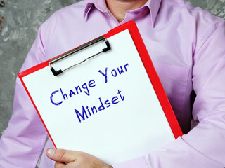 Motivational concept about Change Your Mindset with inscription on the page.