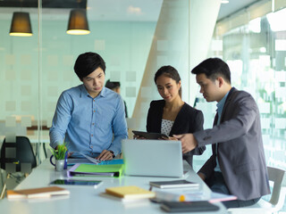 Businesspeople brainstorming on their business project in meeting room