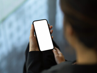 Female hand using smartphone include clipping path in blurred background