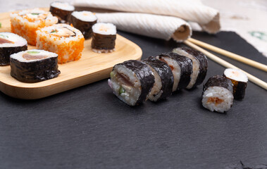 rolls freshly sushi on a stone slab close-up