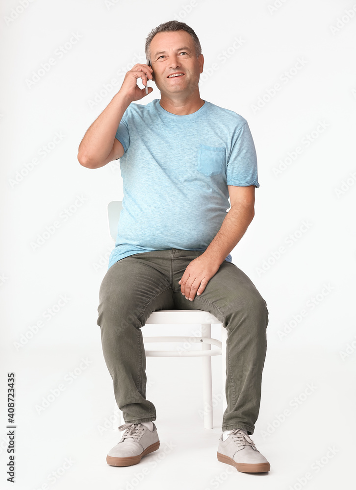 Sticker senior man talking by mobile phone on white background