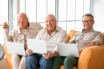 Fototapeta premium Senior people with laptops at home