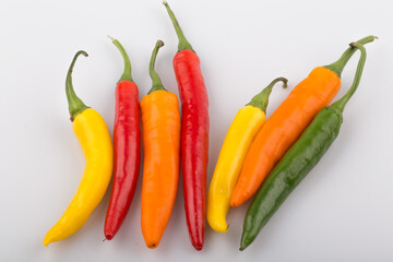 Fresh hot peppers in various color isolated.