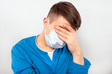 Sad Young Man in Flu Mask