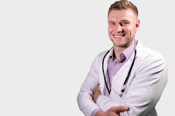 Portrait of handsome male doctor, smiling and looking at camera