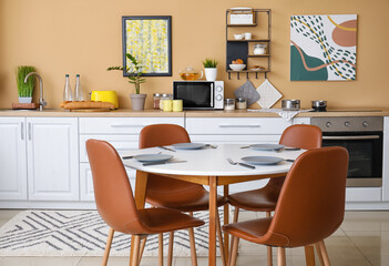 Dinning table in interior of modern kitchen